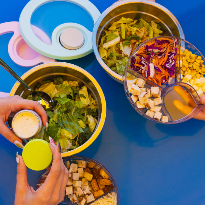 64oz_Stainless Steel_Salad Bowl_life style image_holding_source_jar