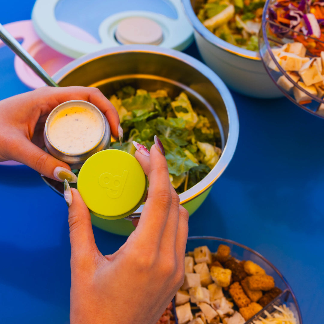 64oz_Stainless Steel_Salad Bowl_life style image_holding_source_jar